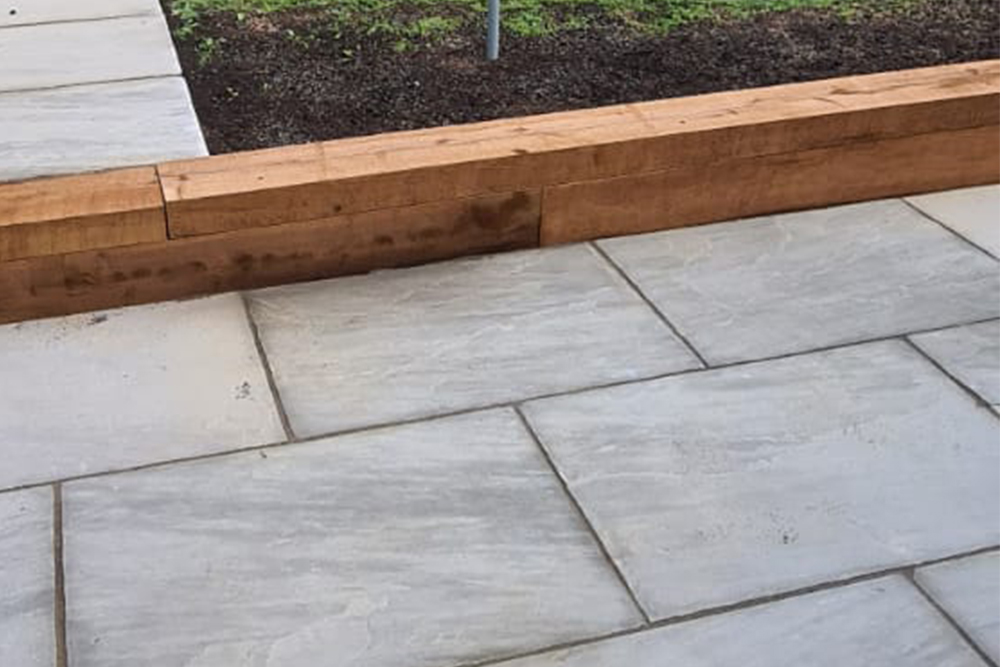 Stone Patio and Landscaping retained by sleepers